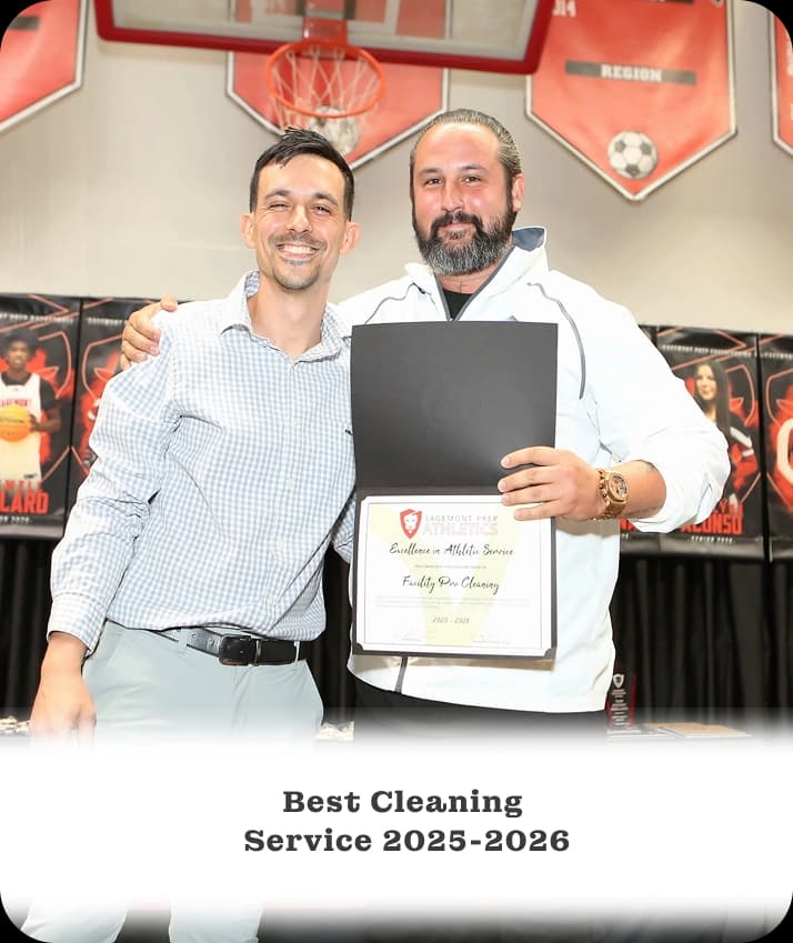 Facility Pro Cleaning owner and employee receiving an award
